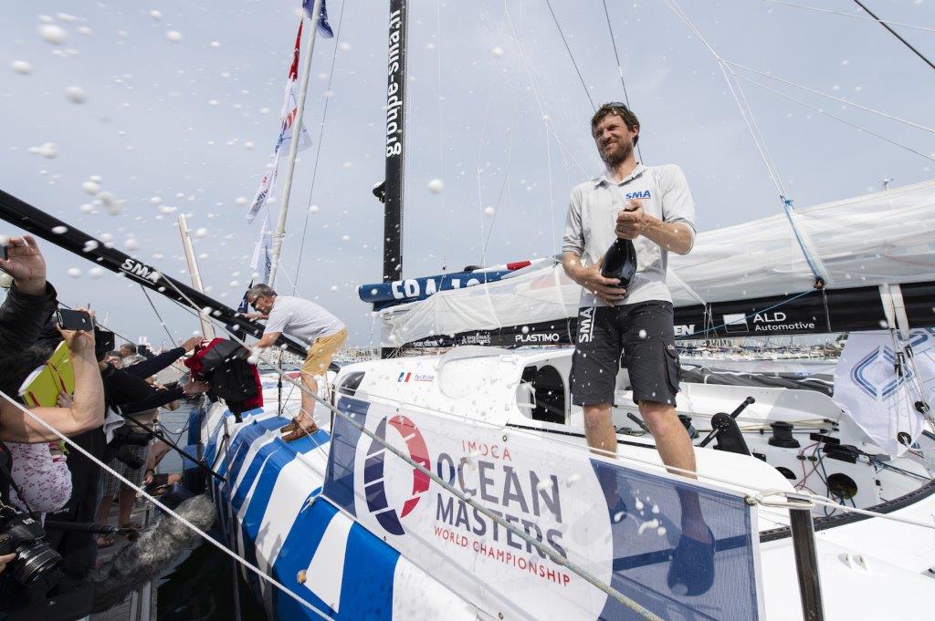 imoca-sma-skipper-paul-meilhat-fra-4th-place-celebration-with-champagne-during-the-arrival-of-the-transat-new-york-vendee-r-1600-1200